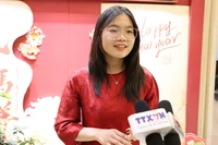 De nombreux étudiants vietnamiens en Chine expriment leur intérêt pour cet événement politique majeur. Photo: VNA