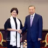 Le dirigeant vietnamien To Lam et Chin Yin Ong, co-présidente et directrice des ressources organisationnelles du groupe Grab. Photo: VNA