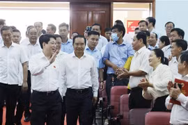 Le président Luong Cuong rencontre des électeurs des districts de Cu Chi et de Hoc Môn. Photo: VNA