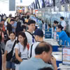Des passagers s'enregistrent à l'aéroport international de Noi Bai. Photo : dangcongsan.org.vn