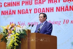 Le Premier ministre Pham Minh Chinh à la rencontre avec des représentants d'entreprises à l'occasion de la Journée des entrepreneurs vietnamiens (13 octobre). Photo: VNA