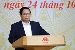 Le Premier ministre Pham Minh Chinh préside une conférence sur l'accélération du développement du logement social. Photo: VNA