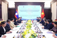 L'entretien entre le président de la Cour populaire suprême du Vietnam, Lê Minh Tri et son homologue lao, Viengthong Siphandon. Photo: VNA