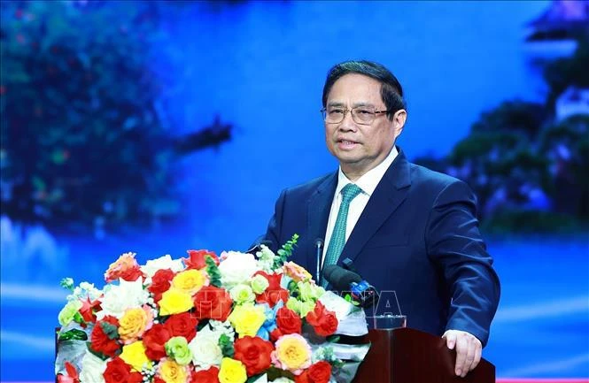 Le Premier ministre Pham Minh Chinh prend la parole lors de la conférence. Photo: VNA