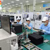 Chaîne de production de la société électronique SAMK WANG, dans le parc industriel de Quang Châu, province de Bac Ninh. Photo: VNA