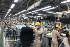 Activités de production de Toyota Boshoku Hanoi. Photo: VNA