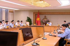 Réunion concernant le déploiement des 11 secteurs technologiques stratégiques. Photo: VNA