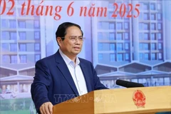 Le Premier ministre Pham Minh Chinh s'exprime lors de la conférence. Photo: VNA