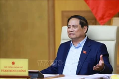 Le Premier ministre Pham Minh Chinh s'exprime lors de la réunion. Photo: VNA