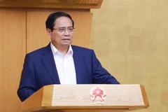 Le Premier ministre, Pham Minh Chinh s'exprime lors de la réunion. Photo: VNA