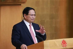 Le Premier ministre Pham Minh Chinh, chef du Comité national de pilotage des ouvrages et projets clés du secteur des transports, s'exprime lors de la réunion. Photo: VNA