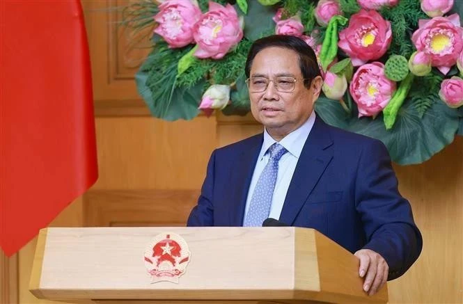 Le Premier ministre Pham Minh Chinh s’exprime lors du dialogue avec le monde des affaires américain à Hanoi, le 13 mai. Photo : VNA