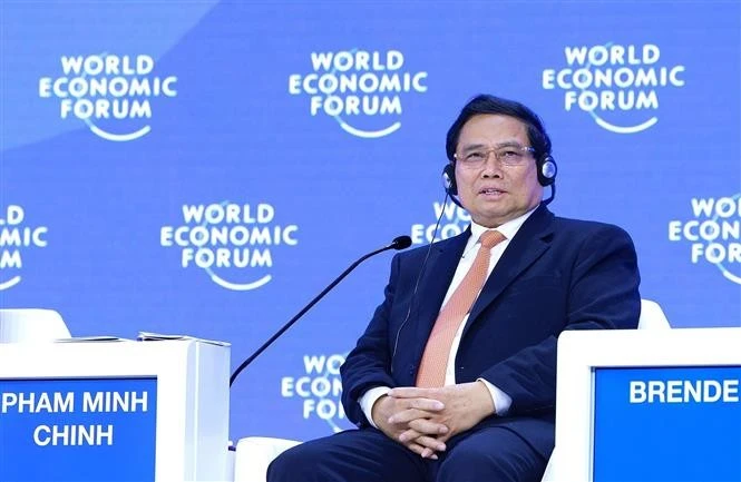 Le Premier ministre vietnamien Pham Minh Chinh lors de la séance de discussion, dans le cadre de la 55e réunion annuelle du WEF à Davos, en Suisse, le 22 janvier. Photo : VNA