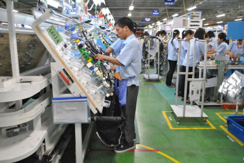 Usine de production de câbles électriques pour voitures et motos dans la compagnie Sumi Vietnam implantée dans le parc industriel de Thanh Liêm, province de Hà Nam (Nord). Photo : VNA