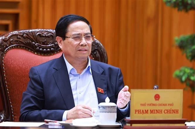 Le Premier ministre Pham Minh Chinh s’exprime lors de la réunion, à Hanoi, le 20 mai. Photo: VNA