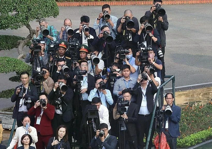 Des journalistes à l'oeuvre. Photo: VNA