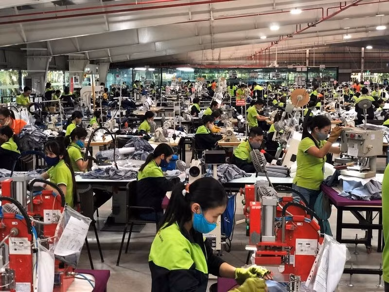 Une entreprise textile à Hung Yên participant à un programme d’amélioration des conditions de travail, de réduction de la consommation d’eau et de réutilisation des matériaux. 