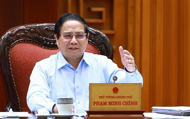 Le Premier ministre Pham Minh Chinh s’exprime lors de la réunion, à Hanoi, le 22 avril. Photo : VNA