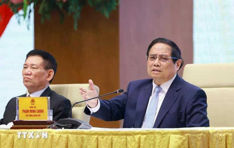 Le Premier ministre Pham Minh Chinh s’exprime lors d’une conférence avec les entreprises publiques à Hanoï le 15 avril. Photo : VNA