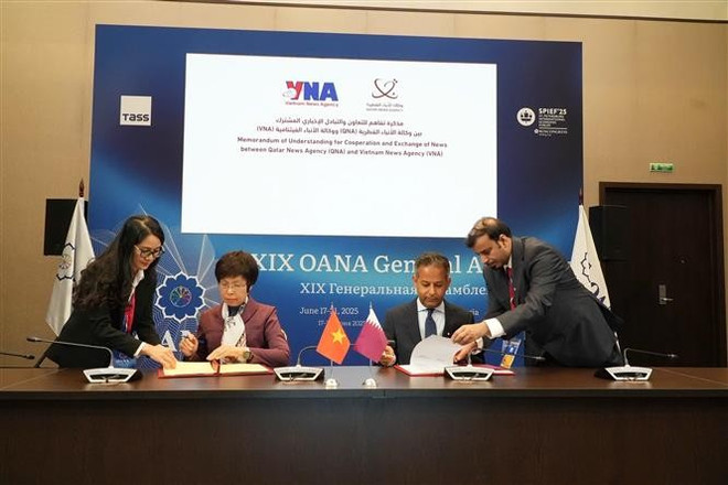 Signature du protocole d'accord entre la VNA et la QNA. Photo : VNA vna-potal-dau-an-tai-dai-hoi-dong-to-chuc-cac-hang-thong-tan-chau-a-lan-thu-19-8102311.jpg