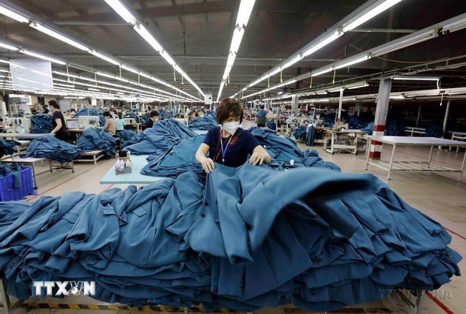 En 2025, de nombreux produits vietnamiens poursuivent leur percée à l’international. Photo: VNA 0604-kinh-te-viet-nam-tay-ban-nha-1.jpg