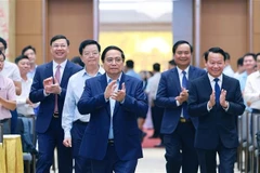 Le Premier ministre Pham Minh Chinh a présidé une conférence nationale en ligne le 22 juin afin d'examiner les programmes nationaux ciblés pour la construction de Nouvelle ruralité et la réduction durable de la pauvreté. Photo : VNA