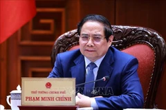 Le Premier ministre Pham Minh Chinh lors de la réunion. Photo : VNA