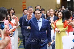 Le Premier ministre Pham Minh Chinh a rencontré des représentants de la communauté vietnamienne en Chine le 31 août. Photo : VNA