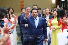 Le Premier ministre Pham Minh Chinh a rencontré des représentants de la communauté vietnamienne en Chine le 31 août. Photo : VNA