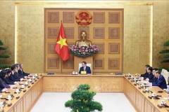 Le Premier ministre Pham Minh Chinh a reçu, le 25 septembre, à Hanoi, Lin Wu, membre du Comité central du Parti communiste chinois, secrétaire du Comité du Parti de la province du Shandong et président du Comité permanent de l’Assemblée populaire provinciale du Shandong, en visite de travail au Vietnam. Photo : VNA