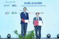 Echange d'un accord portant sur le déploiement du projet « Énergie propre, abordable et sûre pour l’Asie du Sud-Est – mise en œuvre au Vietnam » (CASE Vietnam). Photo . VNA