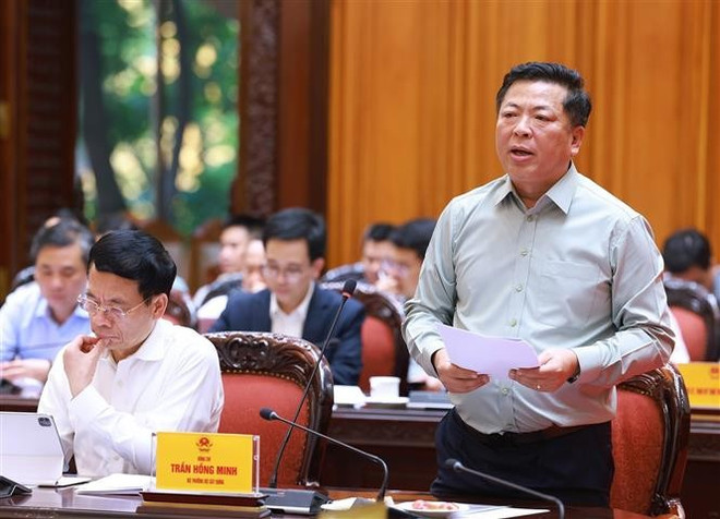 Le ministre de la Construction Trân Hông Minh lors de la réunion, à Hanoi, le 20 mai. Photo: VNA tran-hong-minh.jpg