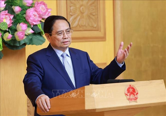 Le Premier ministre Pham Minh Chinh s'exprime lors de l'événement, à Hanoi, le 28 juin. Photo: VNA pham-minh-chinh-uk-vna.jpg