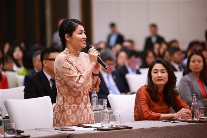 Dô Hông Hanh, une représentants de la communauté vietnamienne en Chine, s’exprime lors de l’événement, à Tianjin, le 25 juin. Photo : VNA vietnamiens-en-chine.jpg
