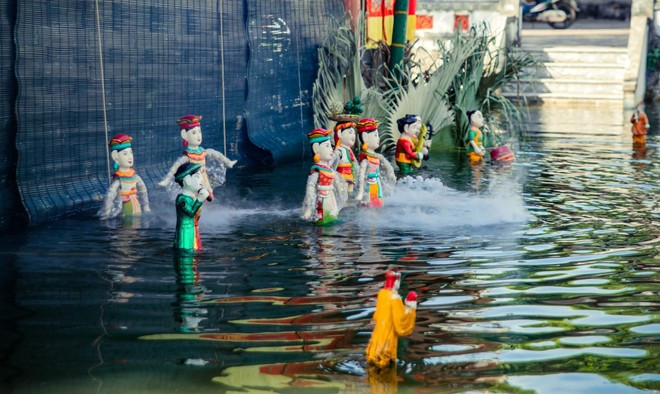 Le répertoire traditionnel du village de Dào Thuc, à Hanoi comprend une bonne vingtaine de numéros puisant leur origine dans les activités quotidiennes des agriculteurs. Photo: VietnamPlus marionettes-dao-thuc.jpg