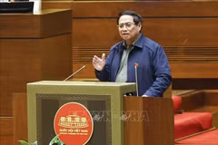 Le Premier ministre Pham Minh Chinh clarifié de nombreuses questions concernant la situation socio-économique, le budget d’État... lors d'un débat à l'Assemblée nationale. Photo : VNA