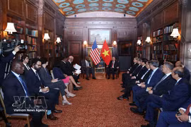 To Lam reçoit une délégation de députés de la Chambre des représentants des États-Unis. Photo : VNA