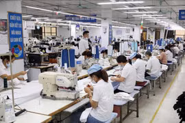 Des ouvriers d'une usine textile exportant des marchandises à Garco 10 à Hanoï. Photo : VNA