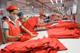 La Sarl Star a investi dans la construction d'une usine spécialisée dans la couture de tricots et de vêtements de sport destinés à l'exportation dans le parc industriel de Phu Nghia, district de Chuong My, à Hanoï. Photo: VNA