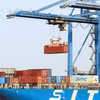 Les ports de Hô Chi Minh-Ville sont toujours en pleine effervescence, avec des navires qui chargent et déchargent des marchandises Photo : VNA