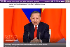 Article sur la visite visite d’État en Russie du secrétaire général et président Tô Lâm sur iz.ru. Photo: VNA