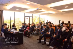 Des délégués assistent à la conférence de promotion de l’investissement. Photo: VNA