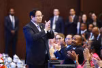 Le Premier ministre Pham Minh Chinh et des délégués à la cérémonie de clôture. Photo: VNA