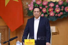 Le Premier ministre Pham Minh Chinh lors de la réunion sur la « Campagne Quang Trung », une opération éclair visant la reconstruction des habitations dévastées par les récentes catastrophes naturelles. Photo : VNA