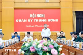 Le secrétaire général du Parti et secrétaire de la Commission militaire centrale Tô Lâm, s'adresse à la conférence, à Hanoi, le 30 mars. Photo: VNA