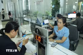 l'authentification électronique au service de la population. Photo : VNA