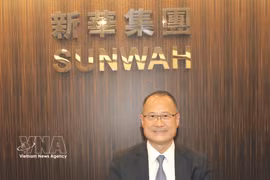 Le Dr Jonathan Choi, président du groupe hongkongais Sunwah, président de la Chambre générale de commerce chinoise de Hong Kong et président du groupe vietnamien VinaCapital. Photo: VNA