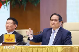 Le Premier ministre Pham Minh Chinh s’exprime lors d’une conférence avec les entreprises publiques à Hanoï le 15 avril. Photo : VNA