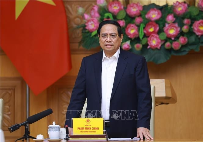 Le Premier ministre Pham Minh Chinh lors de la réunion sur la « Campagne Quang Trung », une opération éclair visant la reconstruction des habitations dévastées par les récentes catastrophes naturelles. Photo : VNA