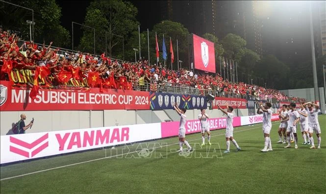 La joie de l'équipe vietnamienne à Singapour. Photo : VNA